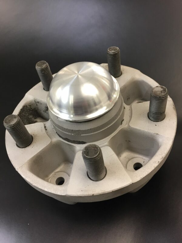 Wagenswest stretched vw bus to Porsche front hub grease cap on a hub